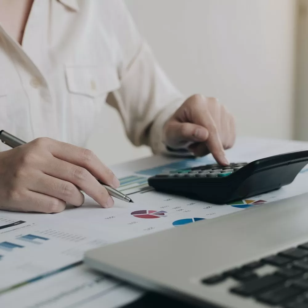 Business woman working in finance and accounting Analyze financial budget in the office